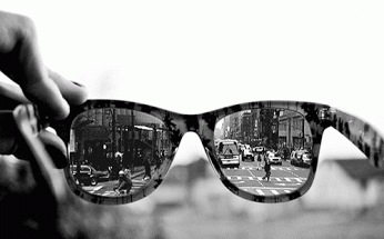 Vibrant City Life Reflected In Sunglasses GIF