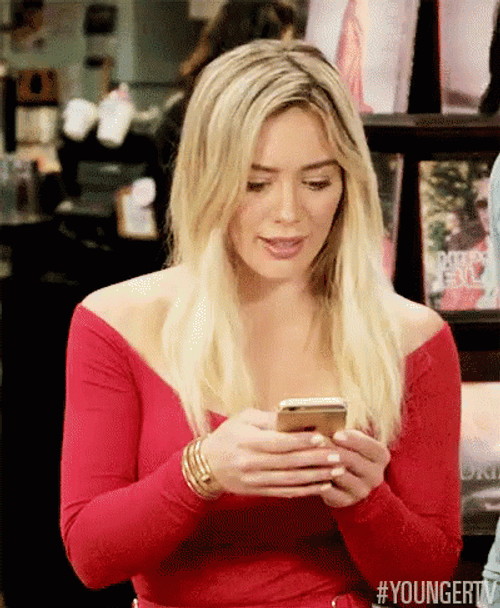 Vibrant Hillary Duff Texting GIF