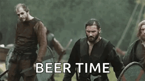 Vikings Standing In Field With Shields And Swords GIF