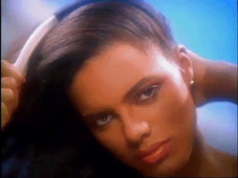 Vintage Combing Black Hair Advertisement GIF