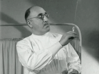 Vintage Doctor Holding Syringe GIF