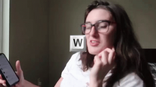 W Key Woman Holding Phone GIF