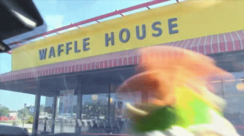 Waffle House With Yellow Awning and Rainbow