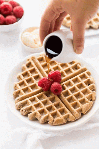 Waffle With Raspberries and Syrup