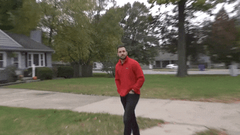 Walking Guy Giving A Smile GIF