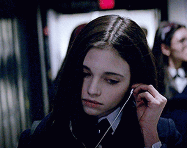 Walking India Eisley Putting On Earphones GIF