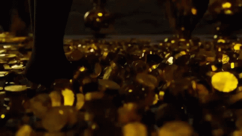 Walking Through Gold Coins GIF