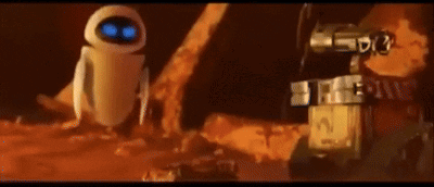 Wall E And Eve From The Movie Wall E Are Standing Next To Each Other In The Dirt GIF