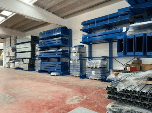 Warehouse Filled With Blue Shelves And Pallets GIF