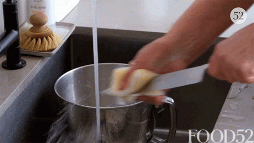 Washing Utility Knife In The Sink GIF