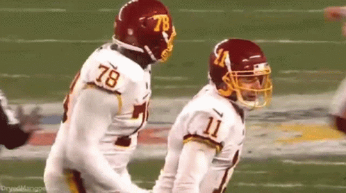 Washington Redskins Players Number 78 And 11 On Field GIF