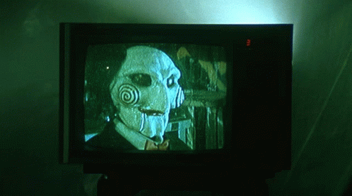 Watching Saw Movie In The Television GIF