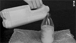 Water Milk Transfer To Bottle Pouring GIF