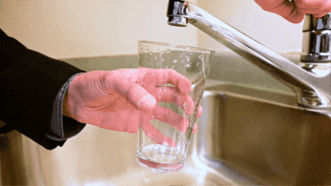 Water Pouring In Glass From Faucet GIF