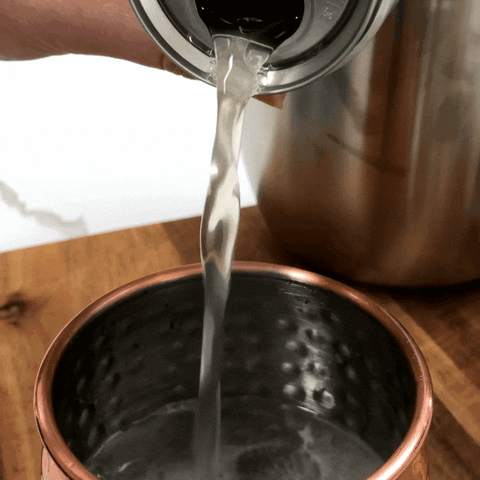 Water Pouring Inside Steel Cup GIF