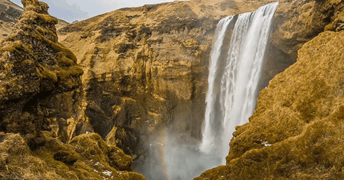 Waterfall In Canyon With Rainbow GIF