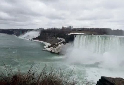 Waterfall In Water With Bridge GIF