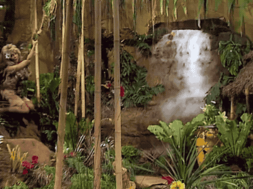 Waterfall Surrounded By Lush Green Jungle GIF