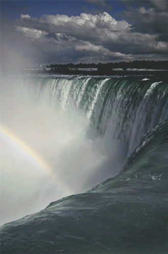 Waterfall With Rainbow In Distance GIF