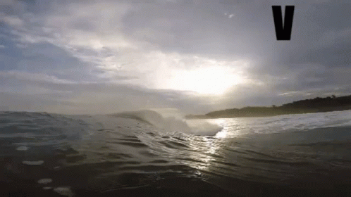 Wave Breaking On Beach With V GIF