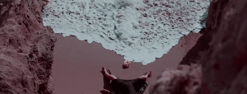 Ocean Waves While Sleeping On The Sand GIF