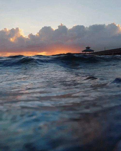 Waves And Sunrise Overlooking GIF