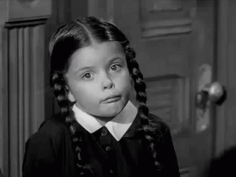 Little Wednesday Addams Shrugging Shoulder GIF