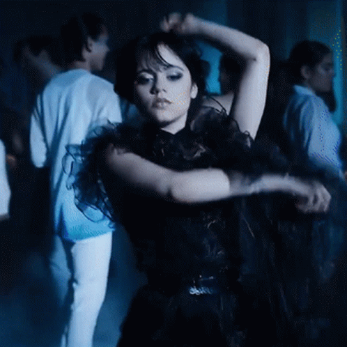 Wednesday Addams Arm Roll Dancing GIF