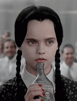 Wednesday Addams Drinking Vino GIF