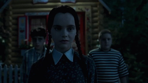 Wednesday Trying To Smile On Addams Family Thanksgiving GIF