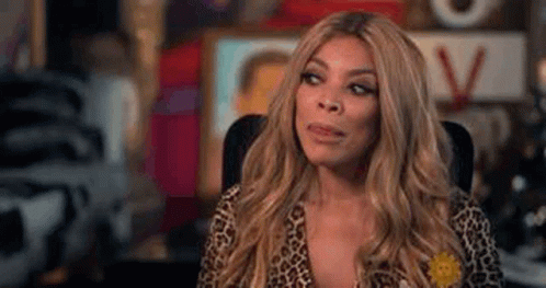 Wendy Williams Sitting In Leopard Print Shirt GIF
