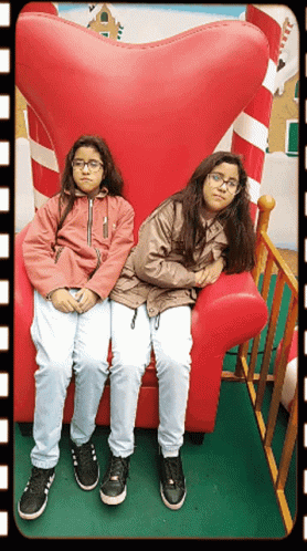 Were Waiting Twins Sitting On Big Chair GIF