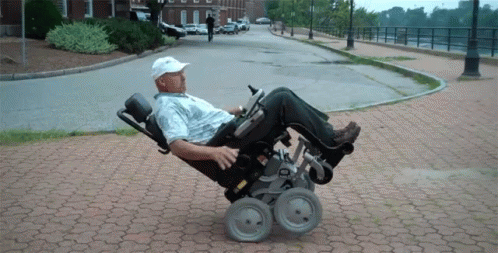 Man Wheelchair Trick GIF