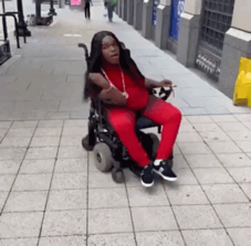 Girl Rolling Wheelchair GIF