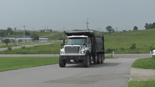 White And Black Dump Truck With NC License Plate GIF