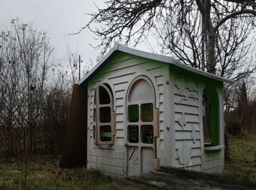 White And Green Playhouse With Sign GIF
