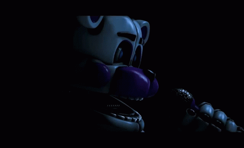 White and Purple Teddy Bear in Dark