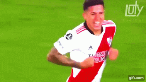 White and Red Soccer Player Celebrating Goal