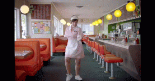 White Apron Waitress Dancing In Diner GIF