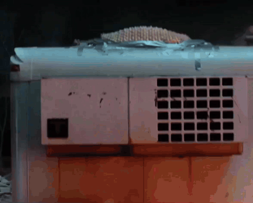 White Box With Squares Taped To Ceiling GIF