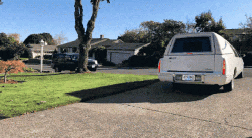 White Cadillac Parked In Driveway With California License Plate DF-290 GIF