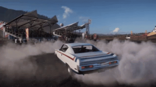 White Car Drifting on Race Track