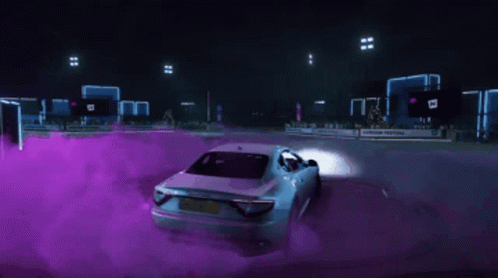 White Car Driving Down Road With Purple Smoke