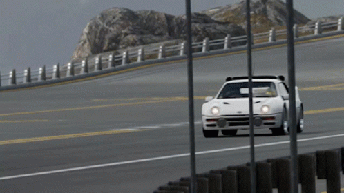 White Car Driving on Highway With Mountain