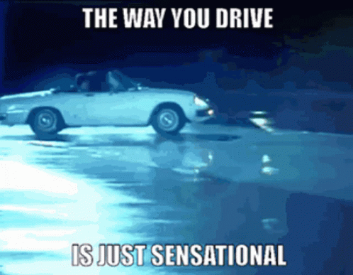 White Car Driving on Wet Road Saying The Way You Drive Is Just Sensational