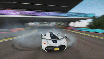 White Car Driving Under Bridge Saying Autoshow