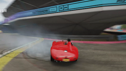 White Car Driving Under Bridge With Autoshow Sign