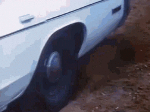 White Car Fender And Wheel Close Up GIF