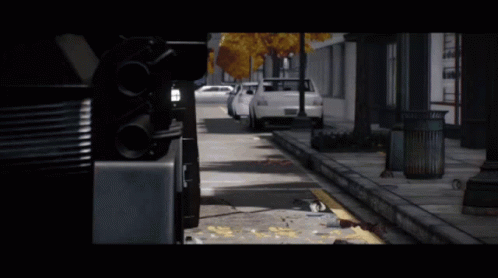 White Car Parked by Roadside Trash Can