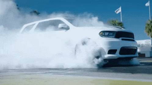 White Car Smoking Tire